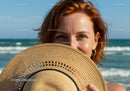 Smiling Woman in Straw Hat at Beach with Ocean View