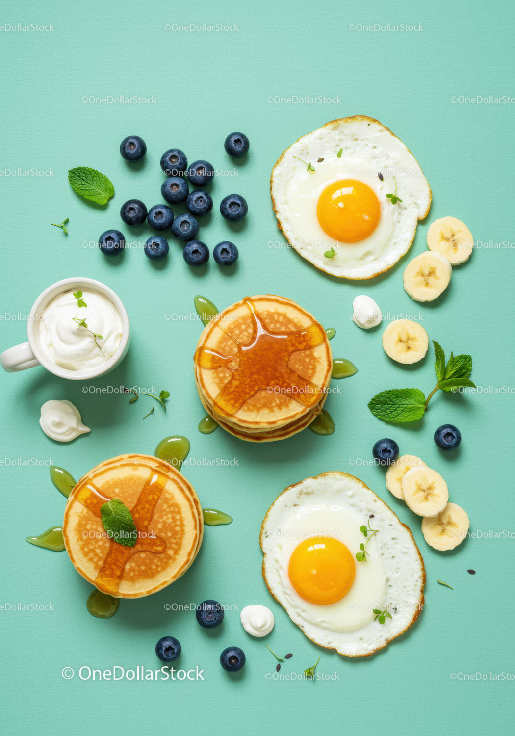 Breakfast Spread with Pancakes Eggs Blueberries and Banana