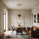 Elegant Modern Dining Room with Leather Sofa and Artistic Wall Decor