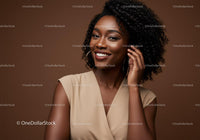 Elegant African American Woman with Curly Hair Wearing Hoop Earrings
