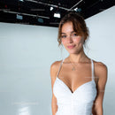 Portrait of a Confident Smiling Woman in Stylish White Dress
