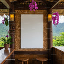 Cozy tropical hut with blank canvas and purple orchids