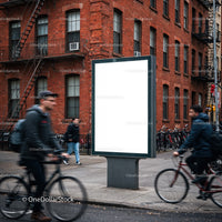 Urban street scene with blank billboard and cyclists