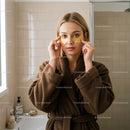 Young Woman Applying Eye Patches for Skincare Routine
