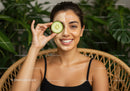 Woman with Cucumber Eye Mask and Facial in Relaxing Spa Setting