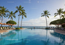 Relaxing Poolside Scene with Tall Palm Trees and Ocean View