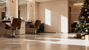 Modern salon interior with Christmas tree and styling chairs