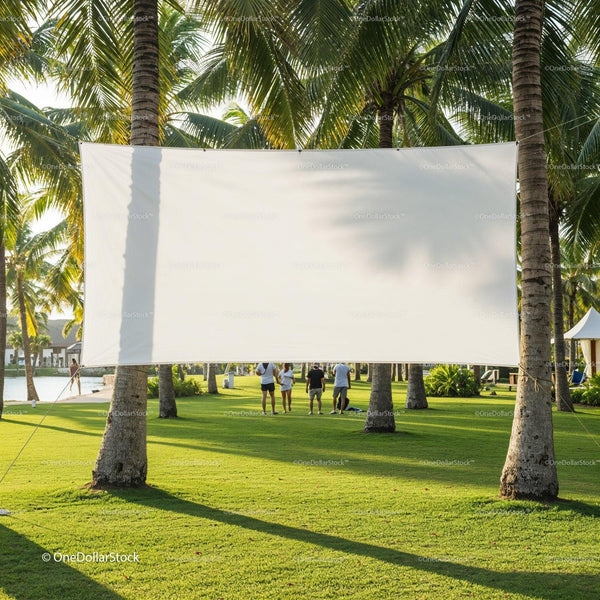 Blank outdoor movie screen hanging between palm trees JPG Mockup Image