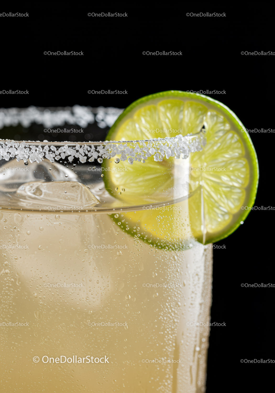 Refreshing Lime Margarita with Salt Rim and Ice Cubes