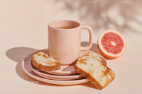 Ceramic Mug with Grapefruit Half and Toasted Bread Slices