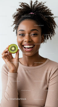 Joyful Woman Holding Kiwi with Bright Smile and Natural Aura