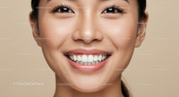 Close up of smiling young woman with healthy teeth