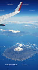 Aerial View of Snow-Capped Mountain and Volcanic Island from Airplane