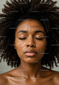 Young woman with curly hair relaxing with facial mask skincare