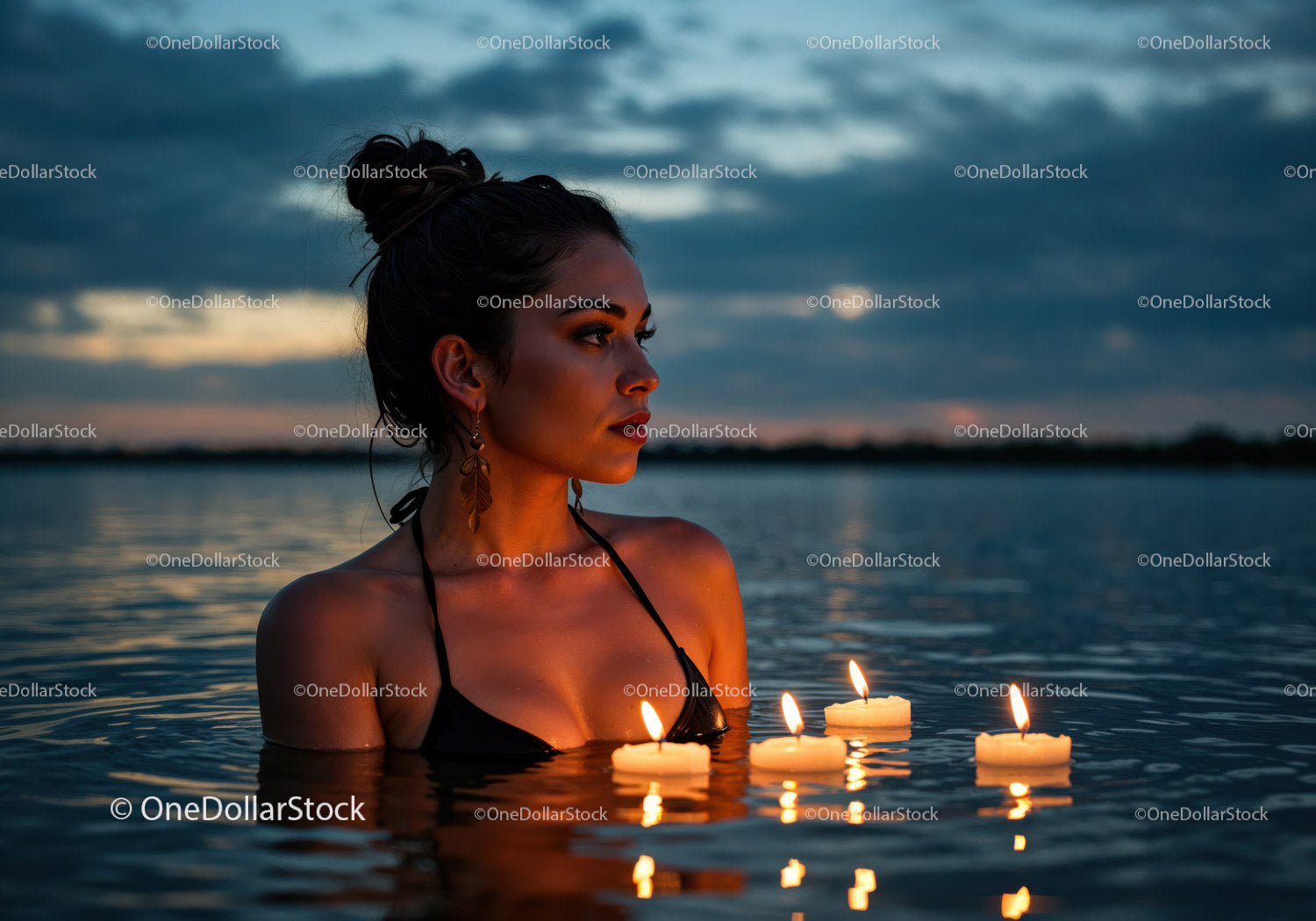 Woman in Black Bikini with Candles Floating in Lake at Sunset