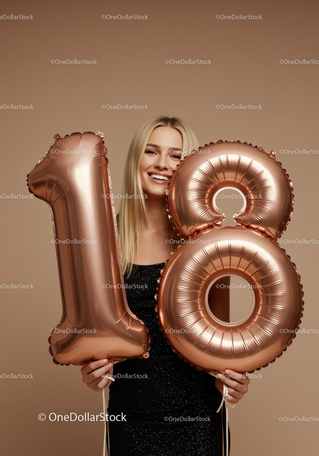 Smiling young woman celebrating 18th birthday with balloons