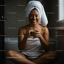 Happy Woman Relaxing with Coffee in Bathroom After Shower