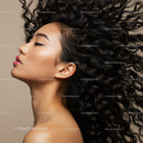 Portrait of serene woman with flowing curly hair