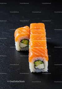 Fresh salmon sushi rolls with avocado and cream cheese