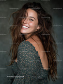 Joyful Woman with Wavy Hair Smiling in Studio Portrait