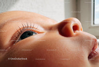 Close-up of a baby looking thoughtfully by the window
