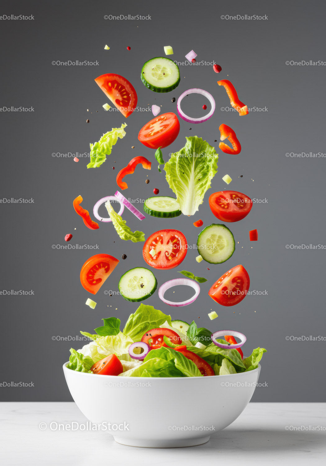 Fresh vegetable salad ingredients falling into white bowl