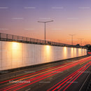 City Highway with Light Trails During Sunset in Urban Environment
