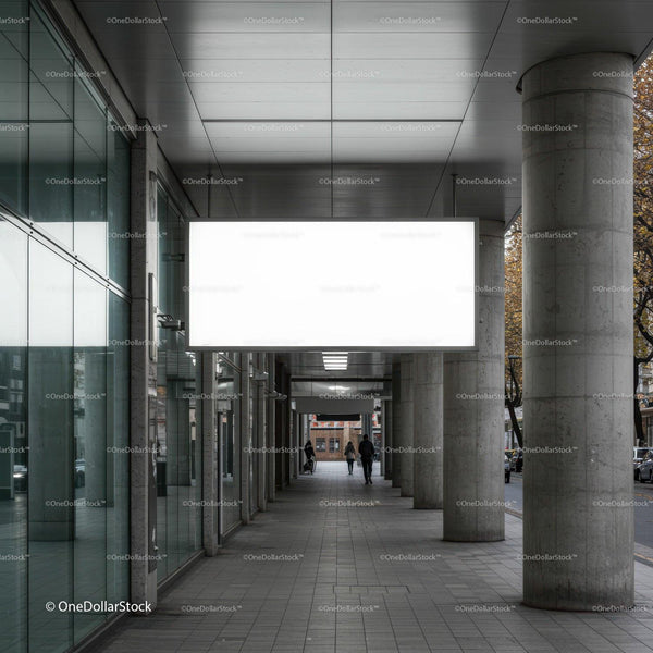 Urban walkway with modern columns and blank billboard JPG Mockup Image