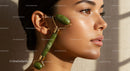 Young Woman Using Jade Facial Roller for Skin Rejuvenation