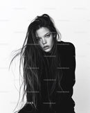 Black and White Portrait of a Woman with Wet Hair and Intense Gaze