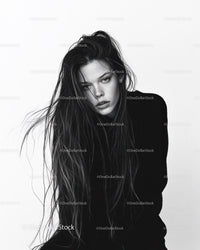 Black and White Portrait of a Woman with Wet Hair and Intense Gaze