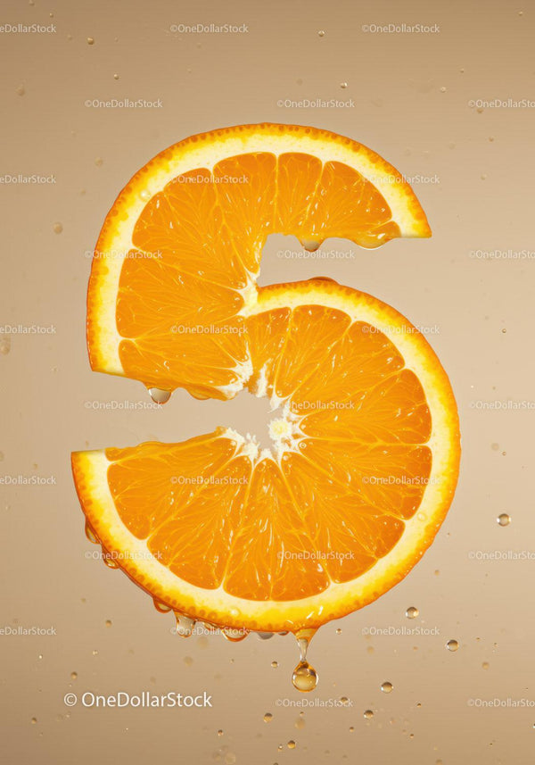 Fresh orange slice shaped like number five in water