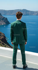 Man in Green Suit Overlooking Blue Ocean Cliffs