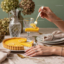 Elegant Lemon Tart Slice Served on a Stylish Dining Table