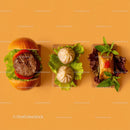 Gourmet Burger with Lettuce and Tomato Next to Grilled Steak and Dumpling