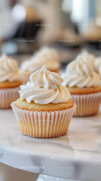Vanilla Cupcakes with Creamy Frosting in a Bakery Setting