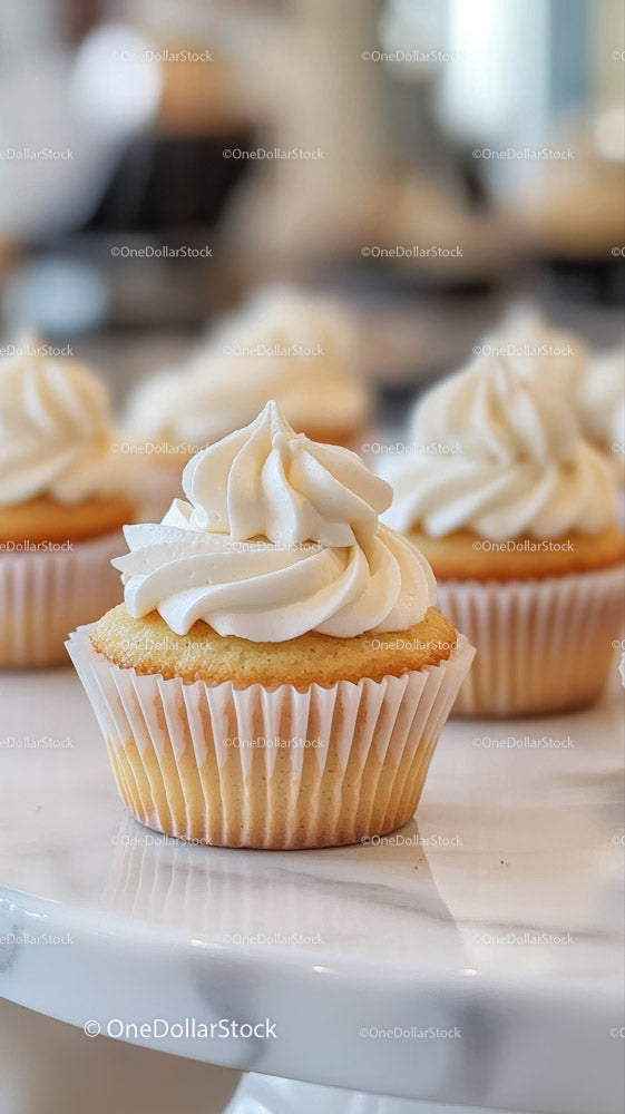 Vanilla Cupcakes with Creamy Frosting in a Bakery Setting