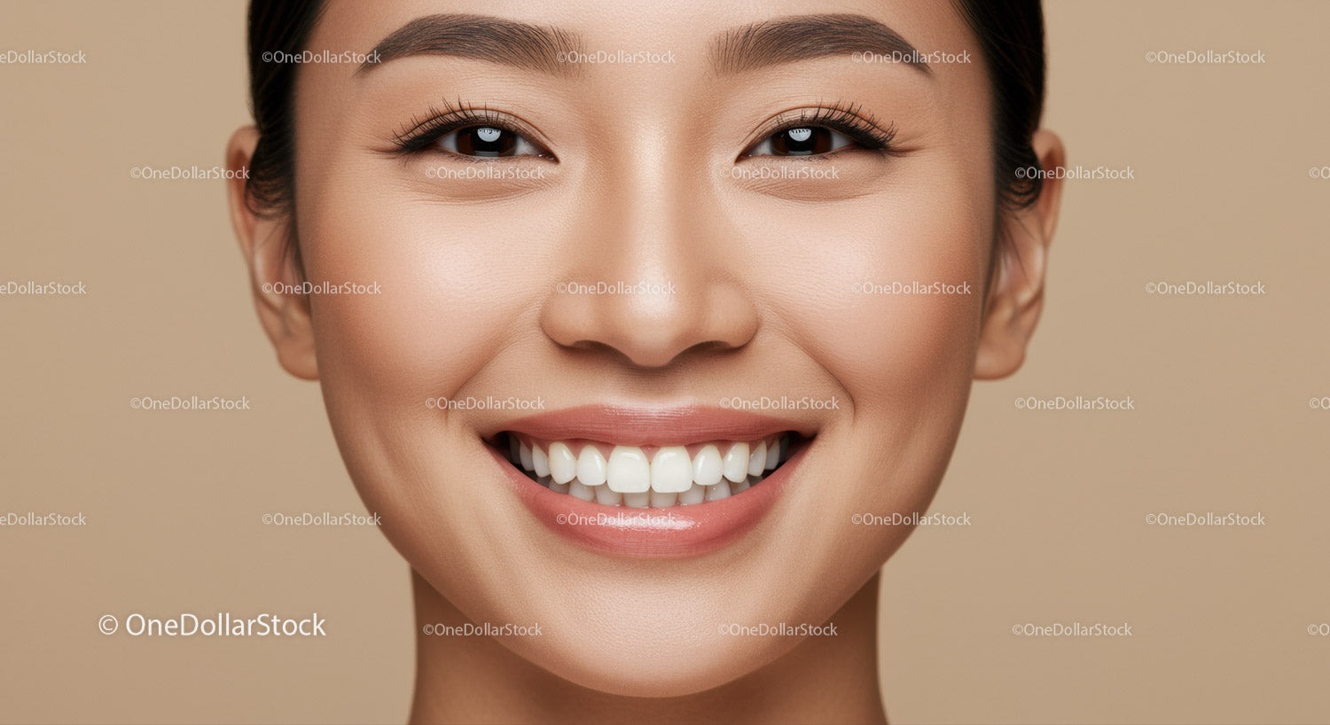Close up of smiling young woman with flawless skin