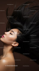 Profile of woman with flowing black hair and closed eyes