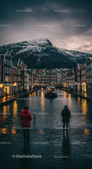 Colorful Houses Along Canal with Snow-Capped Mountain in Dusk