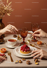 Elegant Tea Time with Raspberry Tart and Vintage Glassware