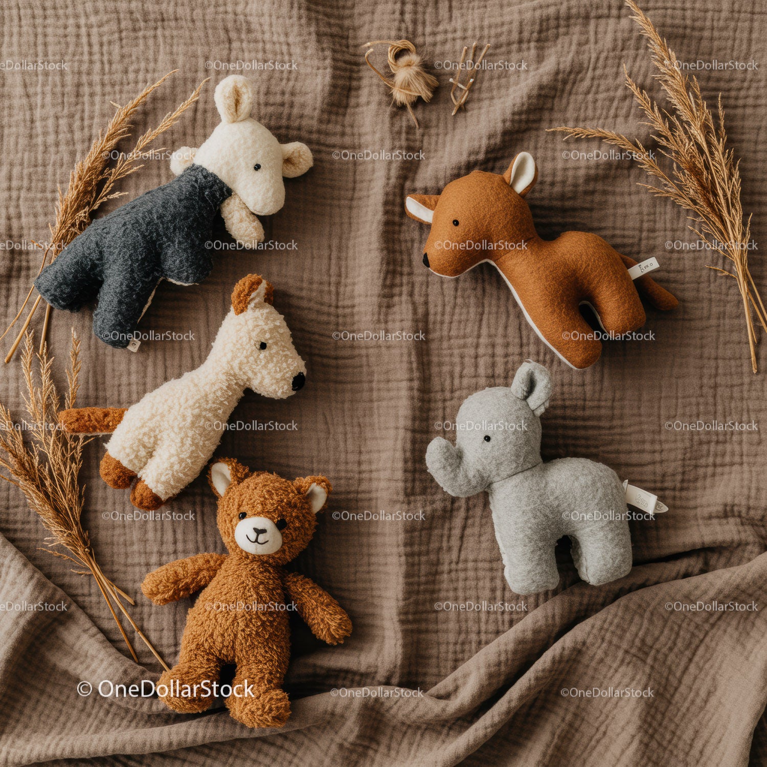 Soft Plush Animal Toys Laid Out on Cozy Fabric