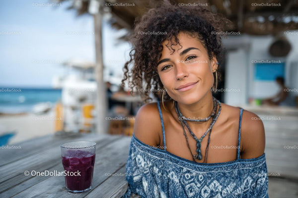 Smiling Woman with Curly Hair at a Tropical Beachside Café