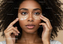 Young Woman with Curly Hair Wearing Under Eye Patches for Skincare
