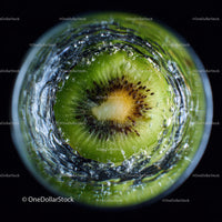 Close-Up of Juicy Green Kiwi Slices with Water Splash