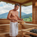 Man Relaxing in Wooden Sauna with Mountain View
