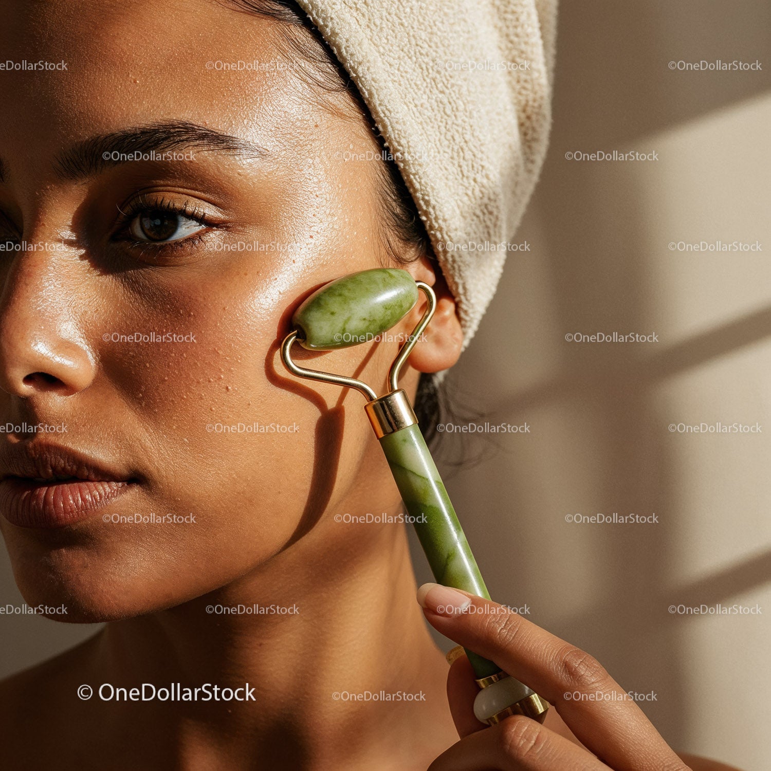 Close-Up of a Woman Using a Jade Roller for Face Massage
