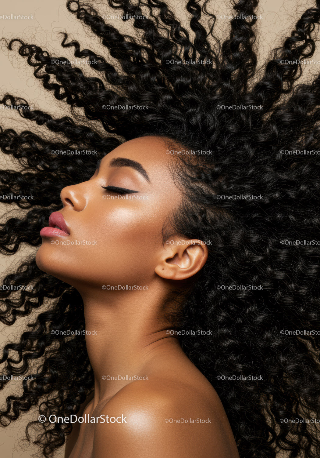 Profile of serene woman with voluminous curly hair