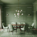Elegant Green Dining Room with Modern Chandelier and Upholstered Chairs
