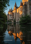 Historic Medieval Castle with Turrets Reflecting in Water